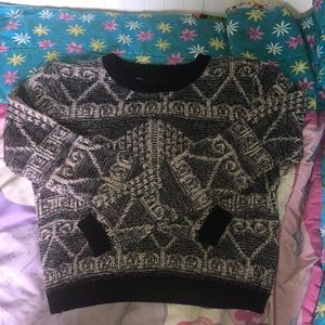 Black and cream sweater with a fun design